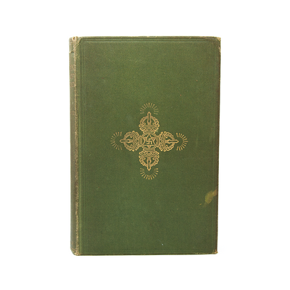 First edition, first printing of a book called The Tibetan Book of the Dead, published in 1927 with golden decorative emblem on a white background.