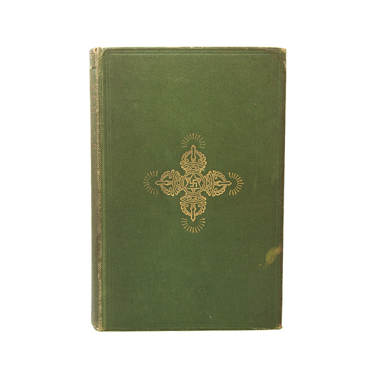 First edition, first printing of a book called The Tibetan Book of the Dead, published in 1927 with golden decorative emblem on a white background.